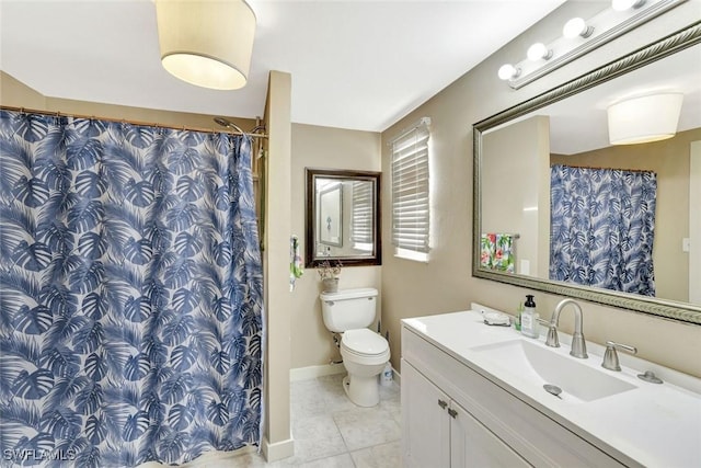 bathroom featuring a shower with shower curtain, toilet, vanity, tile patterned flooring, and baseboards