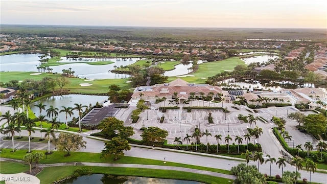 aerial view featuring a water view and golf course view