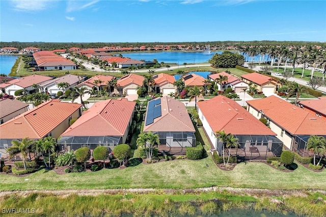 aerial view with a residential view and a water view