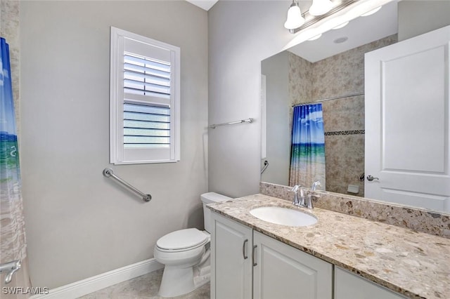 bathroom with curtained shower, baseboards, vanity, and toilet