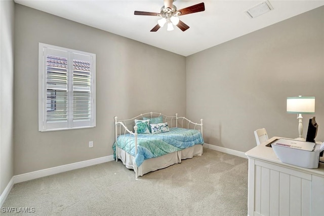 bedroom featuring light carpet, visible vents, and baseboards