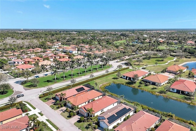 birds eye view of property with a water view and a residential view