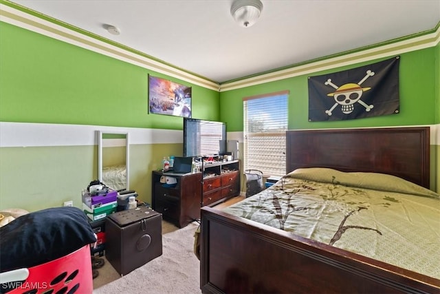 bedroom featuring carpet floors and crown molding