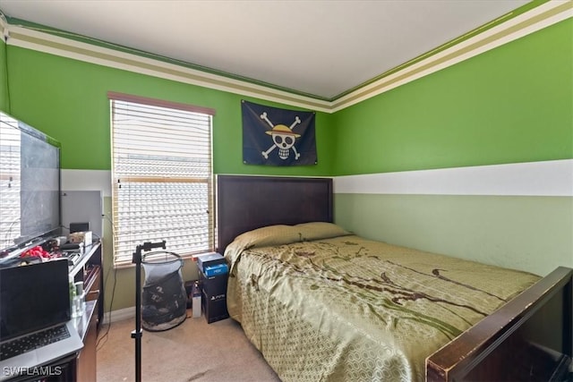 carpeted bedroom featuring ornamental molding, multiple windows, and baseboards