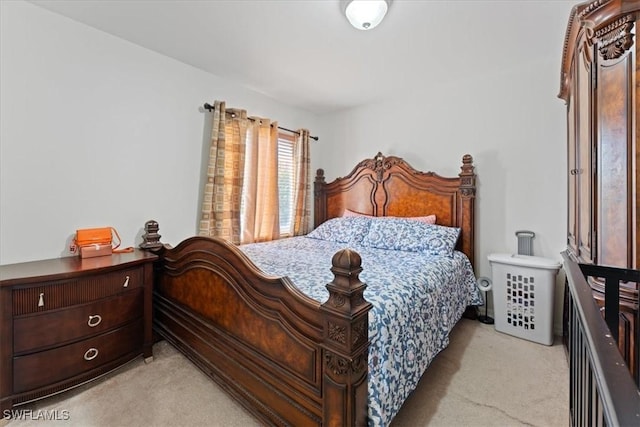 bedroom featuring light colored carpet