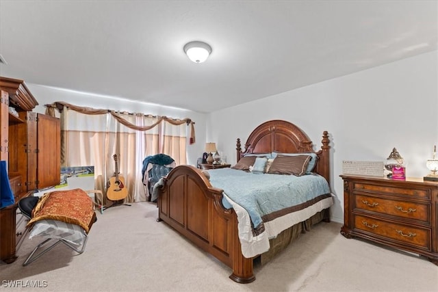 bedroom with light colored carpet