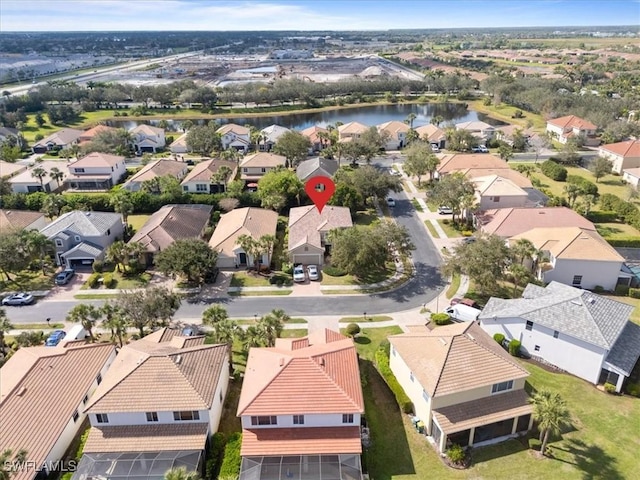 birds eye view of property featuring a water view and a residential view