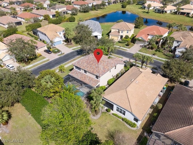 birds eye view of property featuring a water view and a residential view