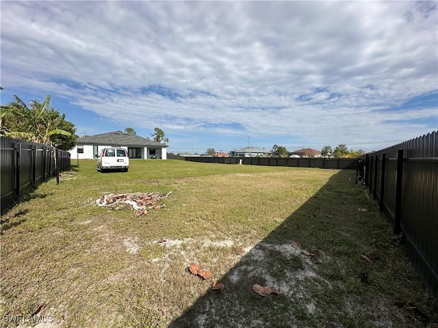 view of yard with a fenced backyard