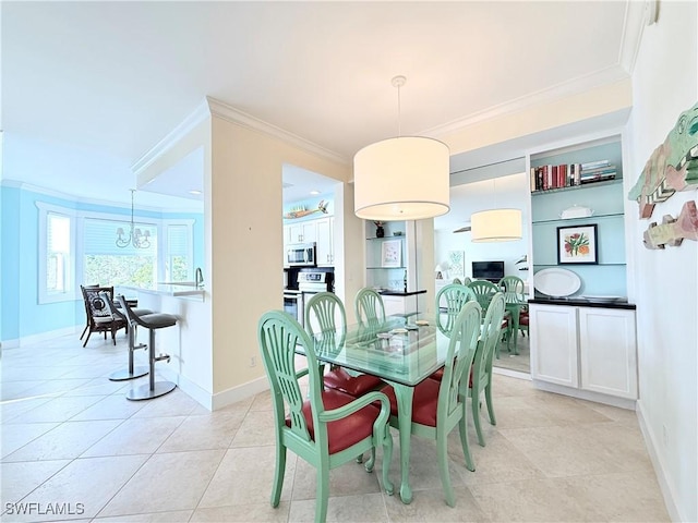 dining area with light tile patterned floors, baseboards, and crown molding