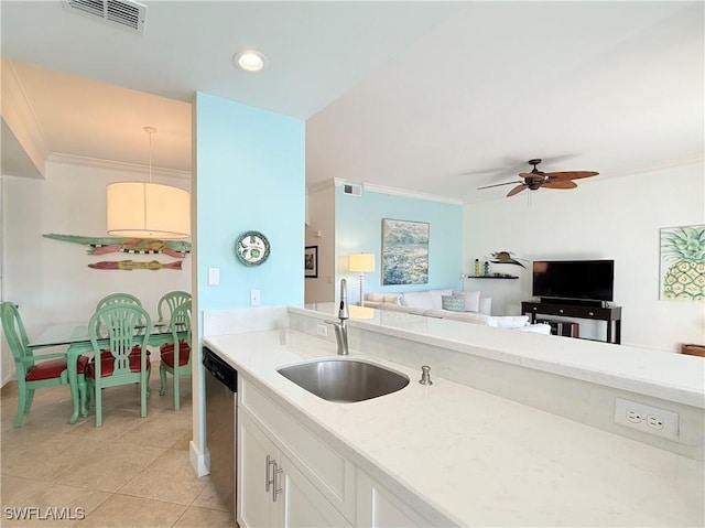 kitchen featuring stainless steel dishwasher, visible vents, a sink, and ornamental molding