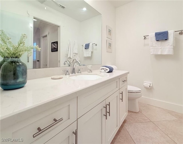 bathroom with visible vents, baseboards, toilet, tile patterned floors, and vanity