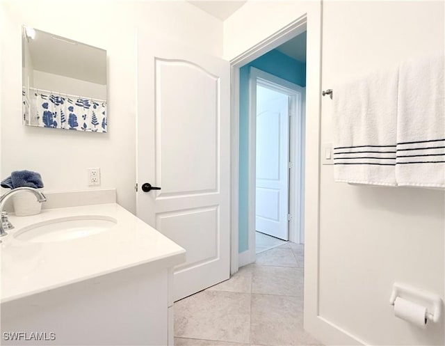 full bathroom featuring vanity and tile patterned floors