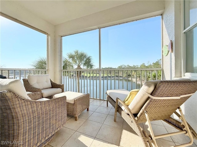 sunroom / solarium with a water view