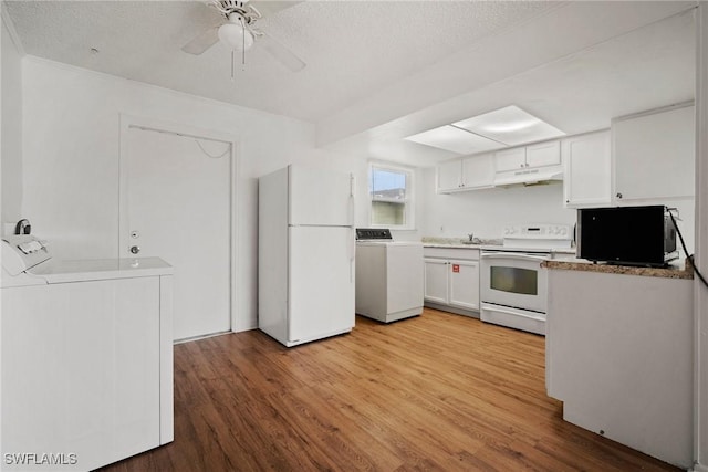 kitchen featuring under cabinet range hood, white appliances, light wood-style floors, white cabinets, and independent washer and dryer