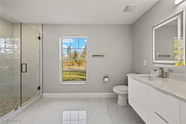 bathroom featuring marble finish floor, a marble finish shower, toilet, and baseboards