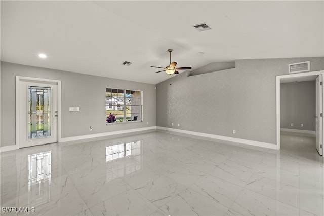 unfurnished room with lofted ceiling, marble finish floor, visible vents, and baseboards