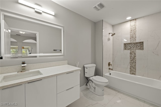 bathroom featuring visible vents, toilet, marble finish floor, bathtub / shower combination, and vanity