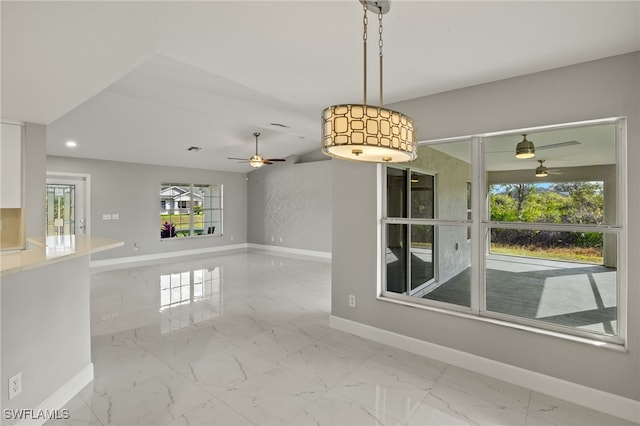 spare room featuring marble finish floor, baseboards, and recessed lighting