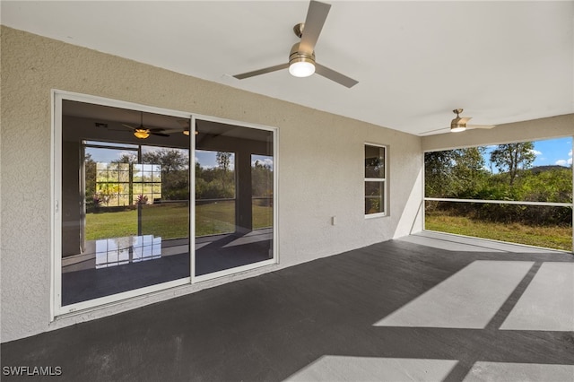 exterior space with ceiling fan