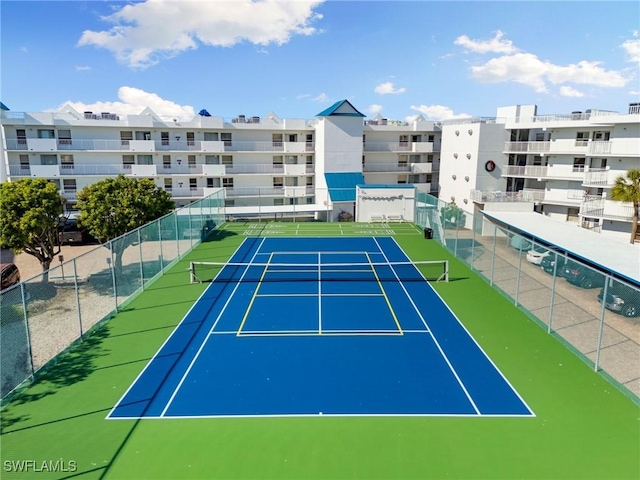 view of sport court with fence