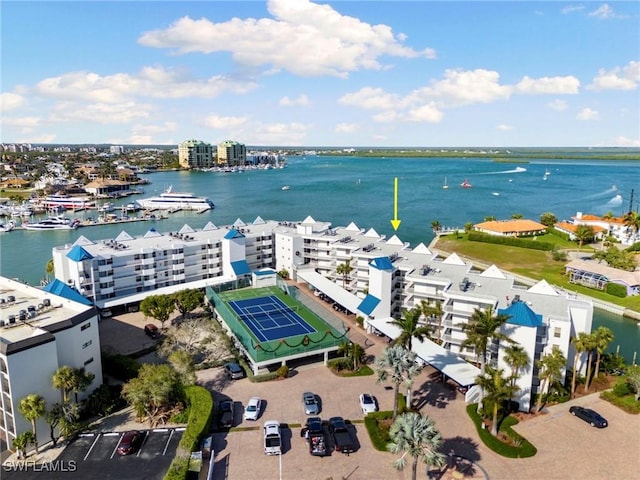 birds eye view of property with a water view