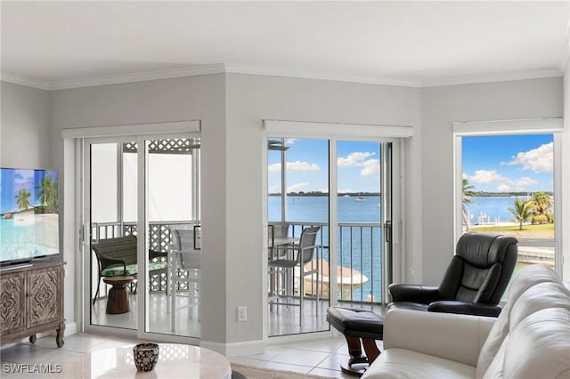 doorway to outside with a wealth of natural light, a water view, crown molding, and light tile patterned floors