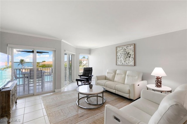 living area with light tile patterned floors and crown molding