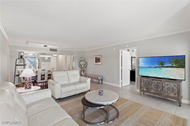 living room with ornamental molding, visible vents, baseboards, and light tile patterned floors