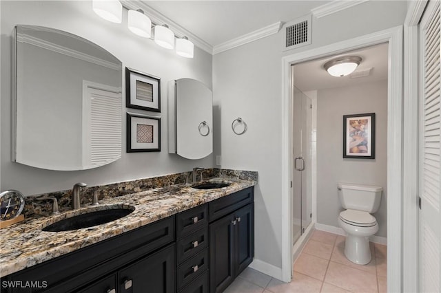 bathroom featuring toilet, a sink, visible vents, tile patterned floors, and crown molding