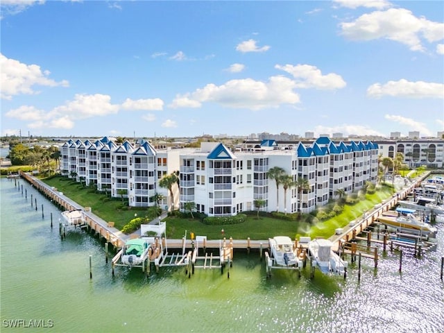 birds eye view of property with a water view