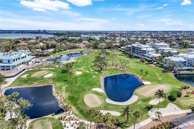 bird's eye view featuring view of golf course and a water view