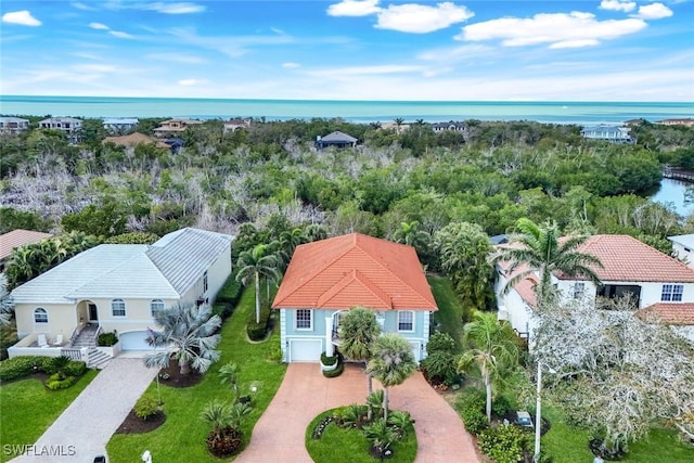 birds eye view of property featuring a water view