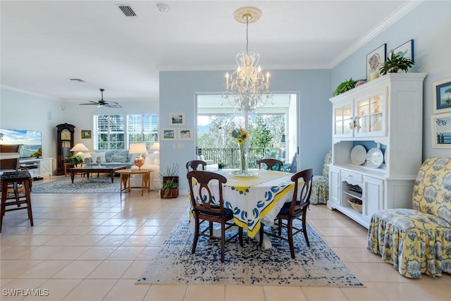 dining area featuring ceiling fan with notable chandelier, light tile patterned flooring, visible vents, and crown molding