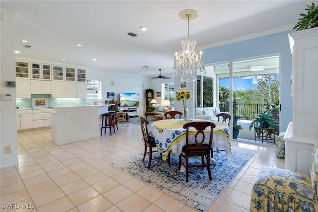 dining room with recessed lighting, visible vents, ornamental molding, light tile patterned flooring, and ceiling fan with notable chandelier