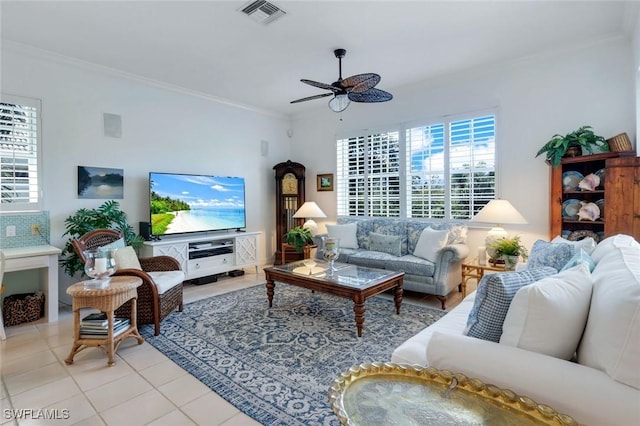 living area with light tile patterned floors, ceiling fan, visible vents, and crown molding