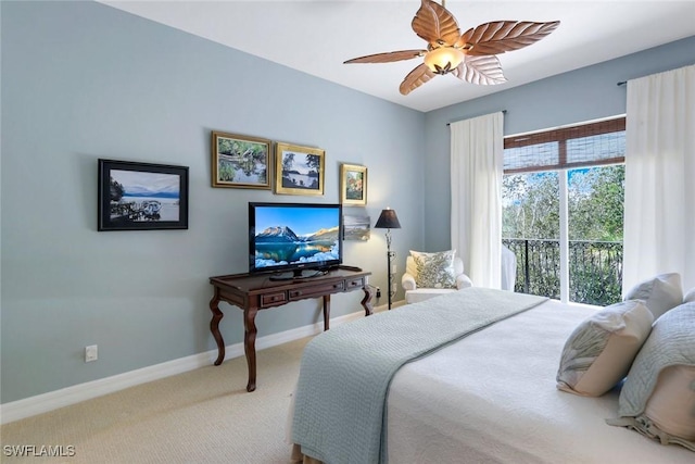 carpeted bedroom with ceiling fan and baseboards