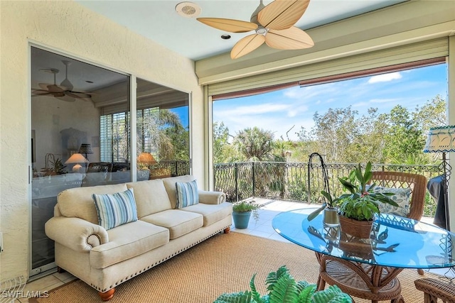 sunroom with a ceiling fan and plenty of natural light