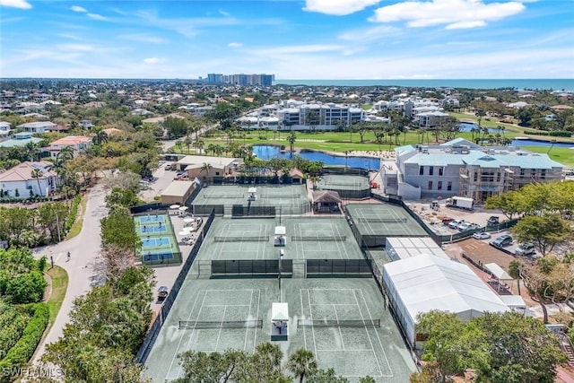 birds eye view of property with a water view