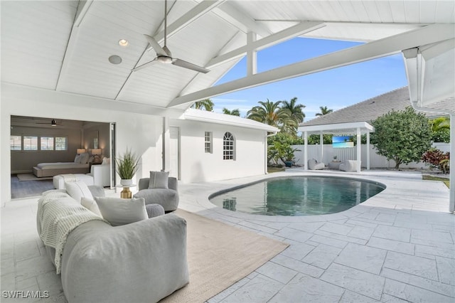 view of swimming pool with ceiling fan, a patio, a fenced backyard, outdoor lounge area, and a fenced in pool