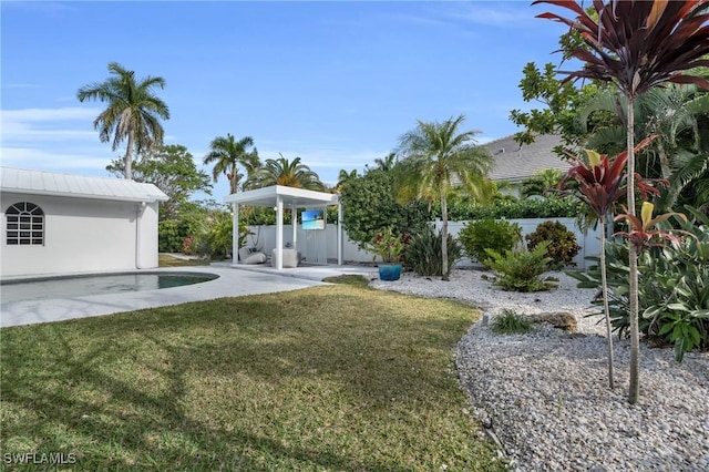 view of yard featuring a patio and fence