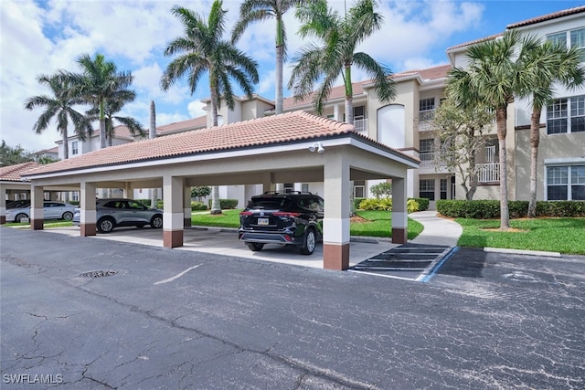 view of partially covered parking lot