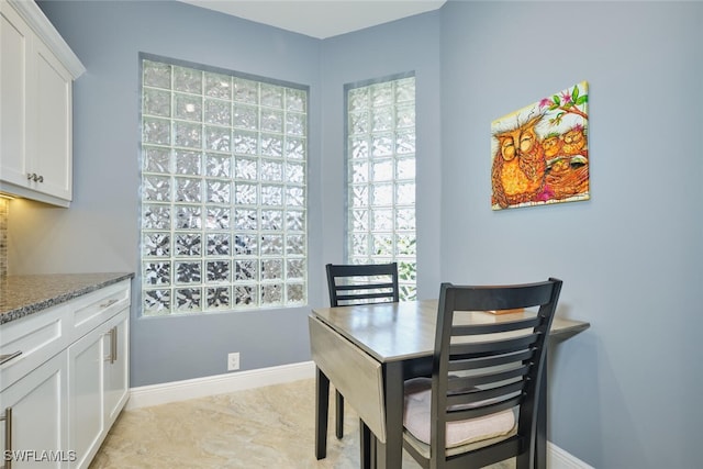 dining room with baseboards