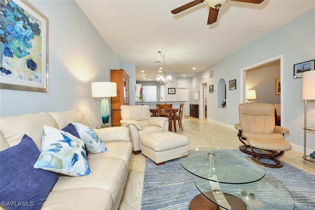 living room with recessed lighting, baseboards, and ceiling fan with notable chandelier