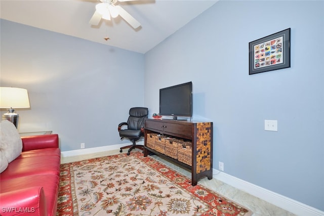 living room featuring vaulted ceiling, carpet, a ceiling fan, and baseboards