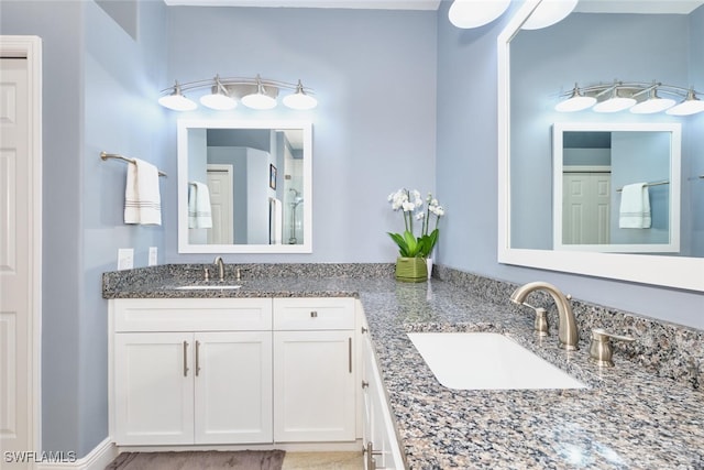 bathroom with double vanity and a sink