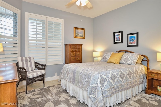 bedroom with carpet flooring, ceiling fan, and baseboards