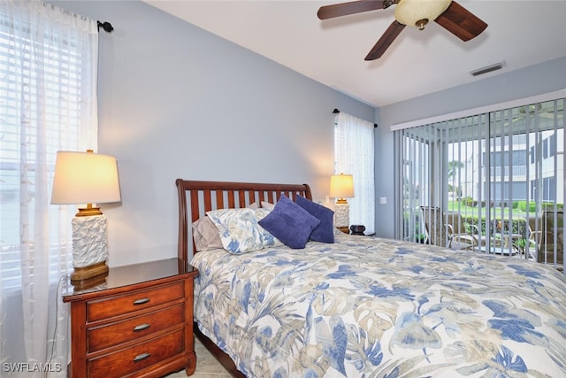 bedroom with access to outside, visible vents, and ceiling fan