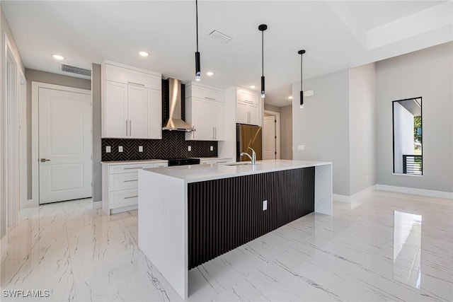 1316 SW 23rd St, Cape Coral, FL 33991 - kitchen with wall chimney range hood, light marble finish floors, a sink, white cabinets, and decorative backsplash