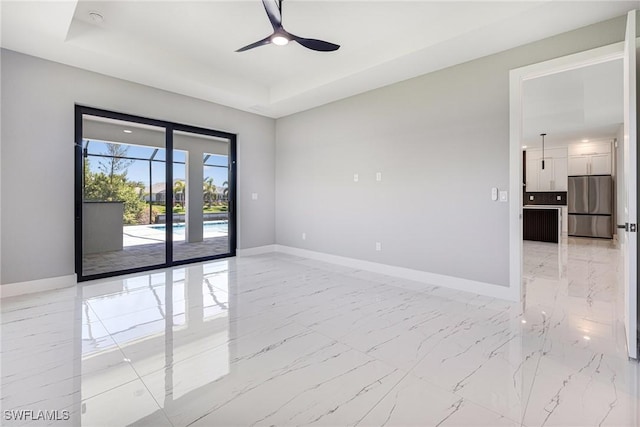 1316 SW 23rd St, Cape Coral, FL 33991 - unfurnished room featuring light marble finish flooring, baseboards, a ceiling fan, and a smoke detector